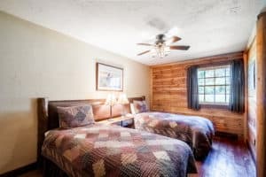 King bed split into two beds in the bedroom of the Garnet cabin at Mountain Sky Guest Ranch