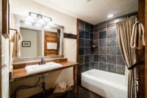 The bathroom & tiled showed at the Garnet cabin at Mountain Sky Guest Ranch
