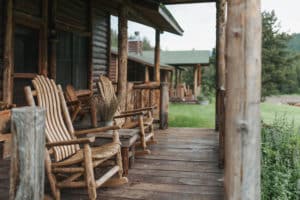 Rocking chairs on the front porch of the Garnet cabin at Mountain Sky Guest Ranch