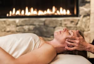 Woman getting craniosacral head massage at Mountain Sky Guest Ranch