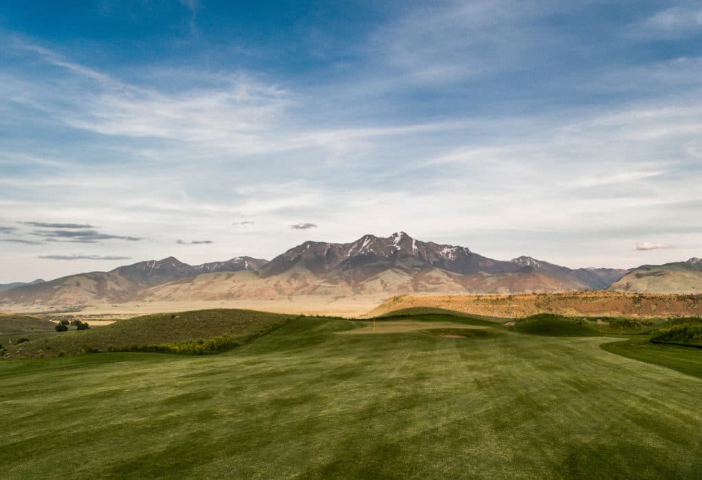 Rising Sun Golf Course at Mountain Sky, with expansive mountain backdrop