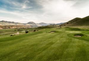 Hole 16 on the Rising Sun Golf Course, with Absaroka and Gallatin mountains in the backdrop