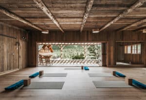 Yoga mats set up in Mountain Sky Guest Ranch's yoga center with mountain backdrop