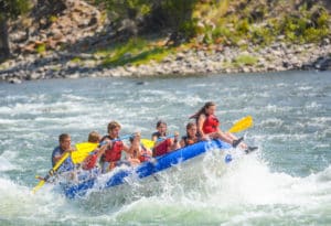 A group of Mountain Sky Guest Ranch's guests white water rafting down the Yellowstone River