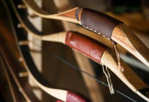 Close up of bows sitting in a rack