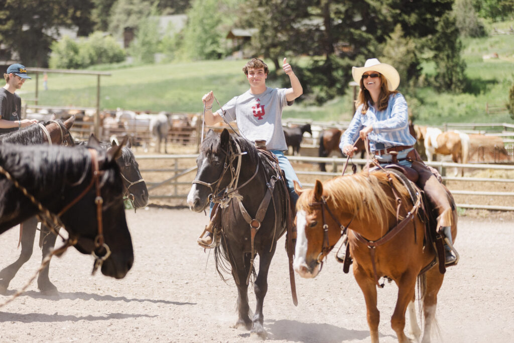 People ride horses at Mountain Sky Guest Ranch in Montana.